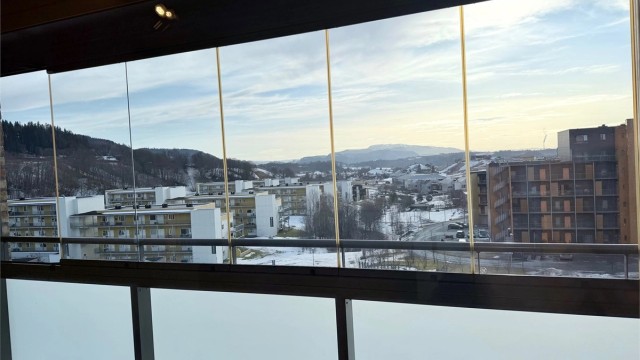Innglasset terrasse som kan åpnes.
