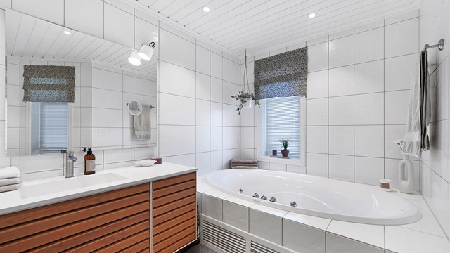 Det innflisede badekaret er perfekt for avslapning.