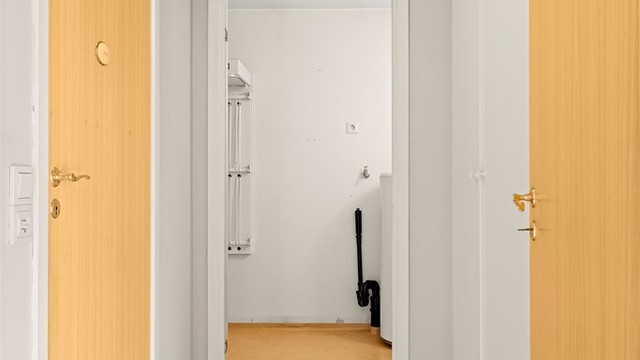 Mellomgangen forbinder leilighetens soverom, bad, vaskerom og boder.