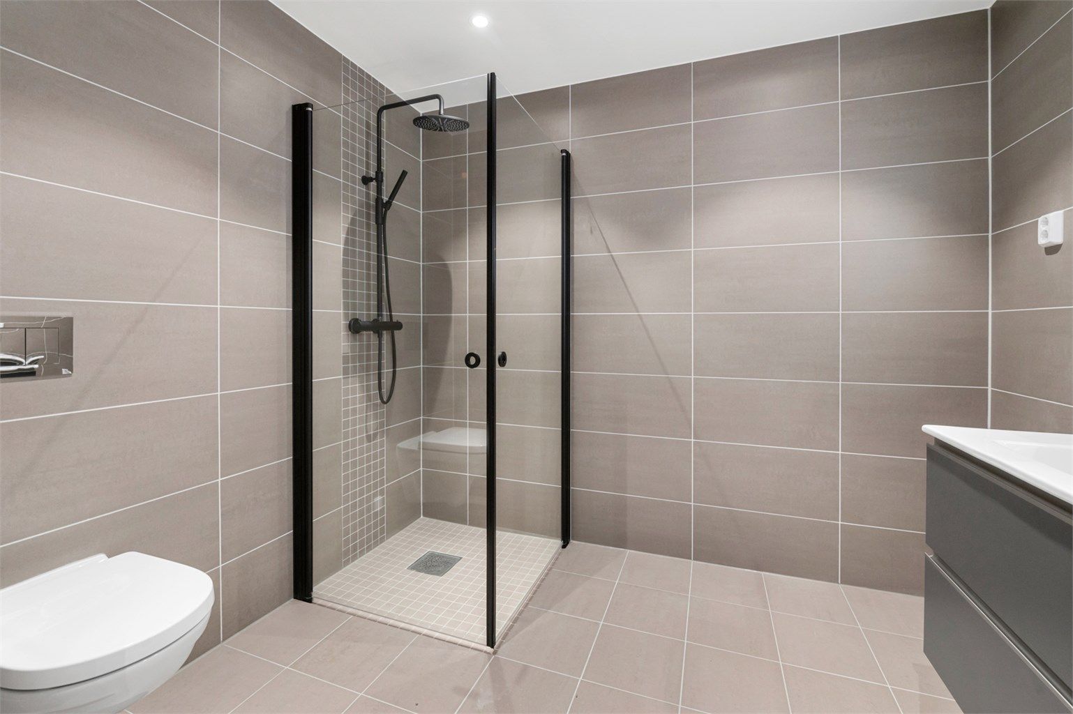 Dusjhjørne med innfellbare vegger.