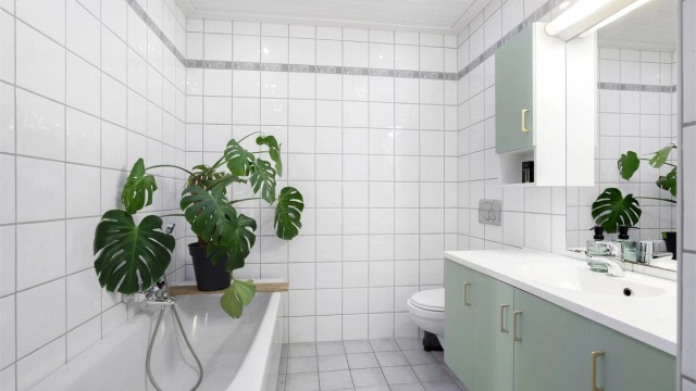 Badet er praktisk innredet med både dusjhjørne og badekar.