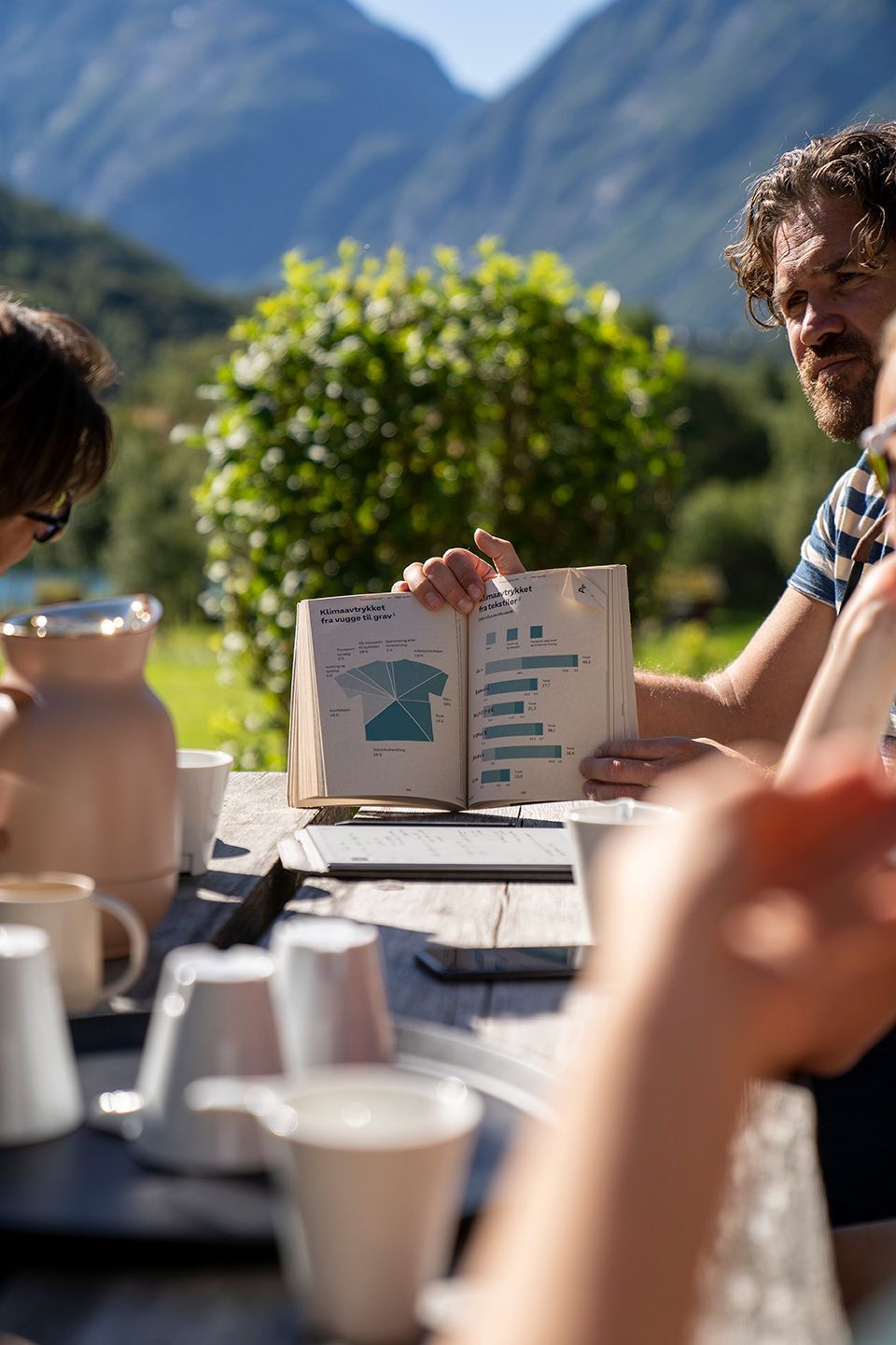 Photo of Jo holding up a book.