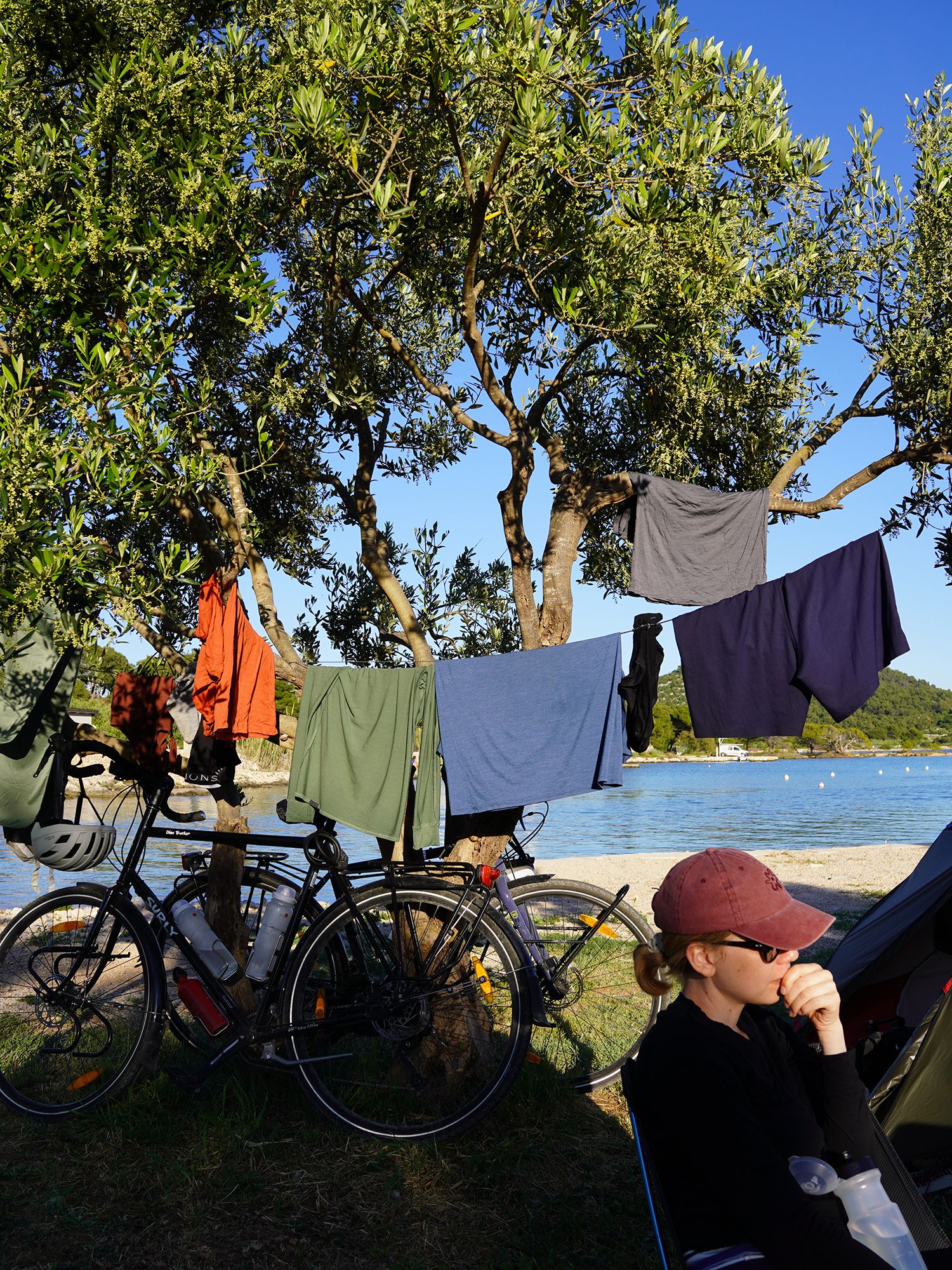 Clothes airing out between two trees in camp