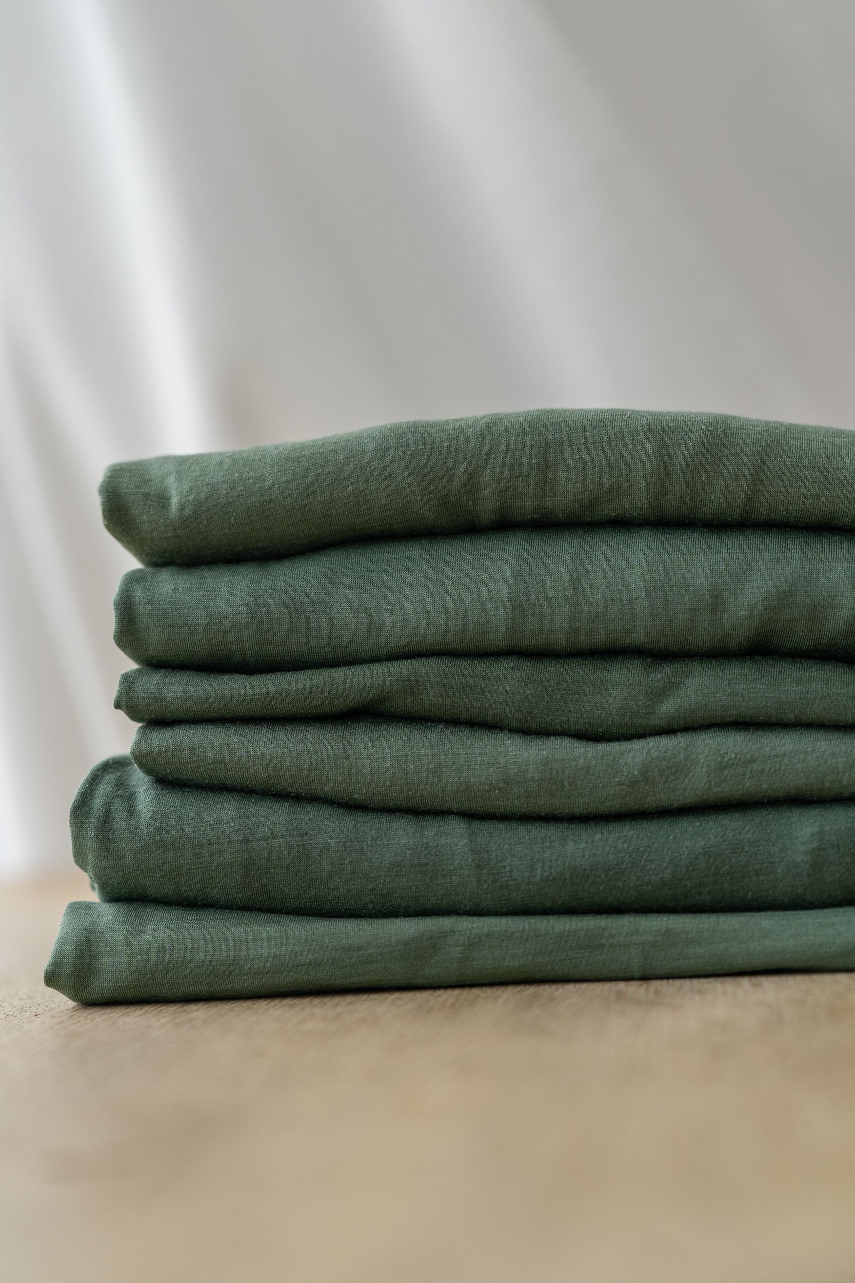 A stack of green t-shirts