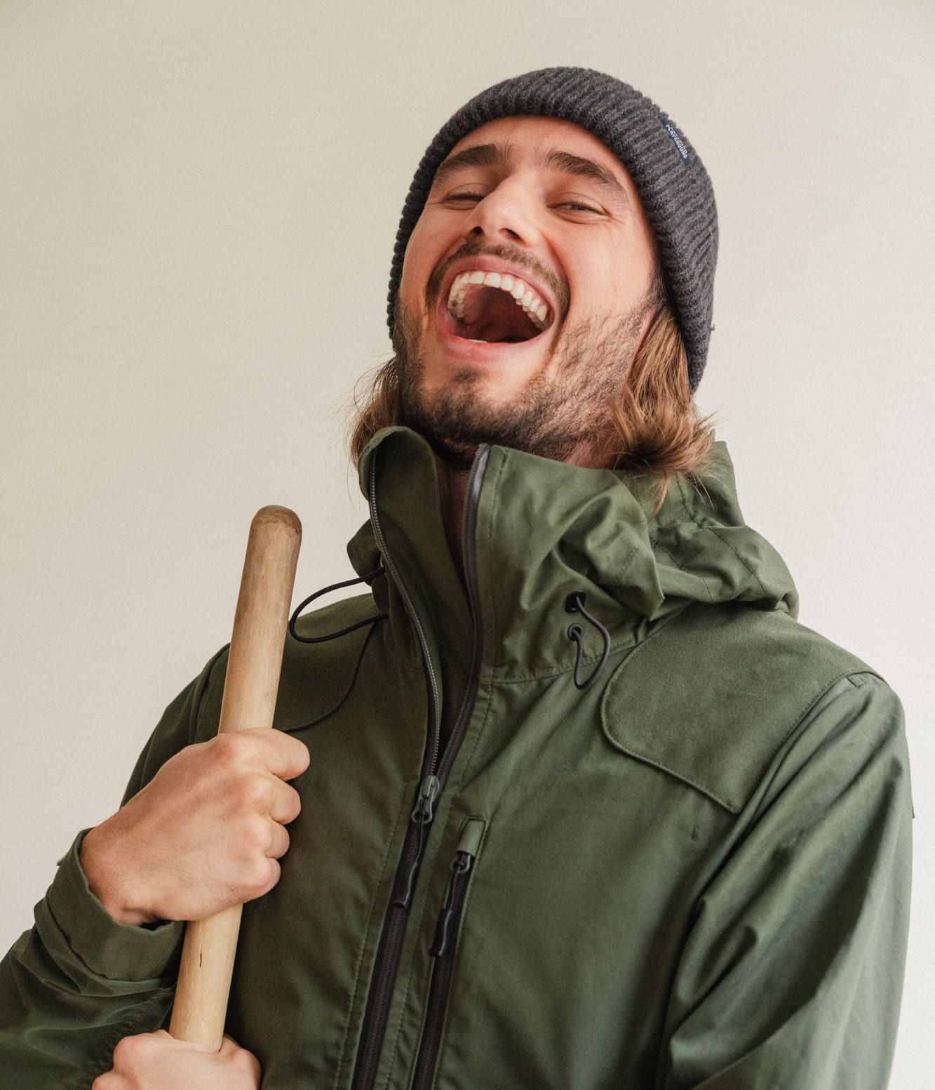Man with a wooden stick in The Last jacket from northern playground