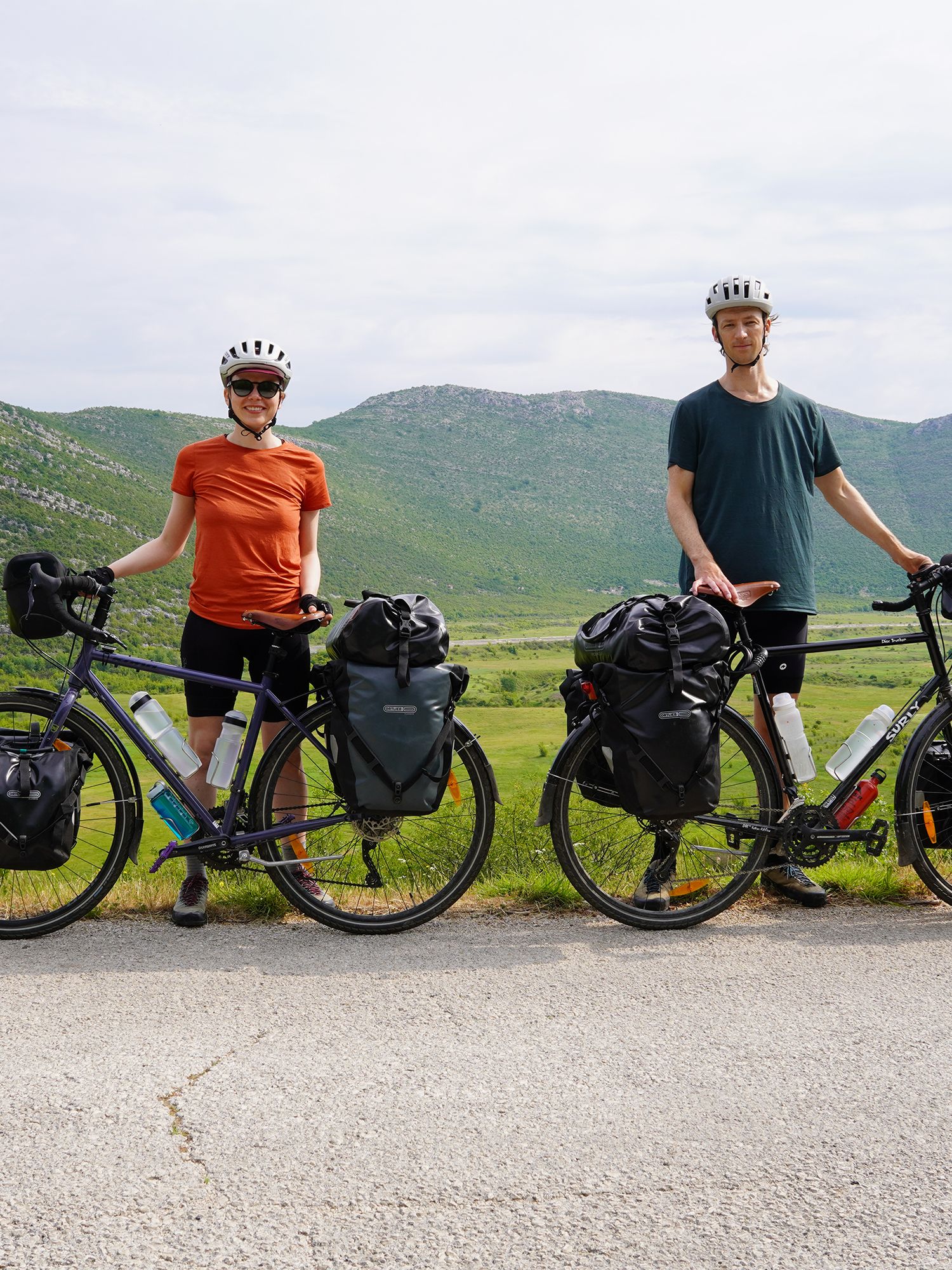 Matt and Lene posing for the camera with their bikes somewhere in eastern Europe