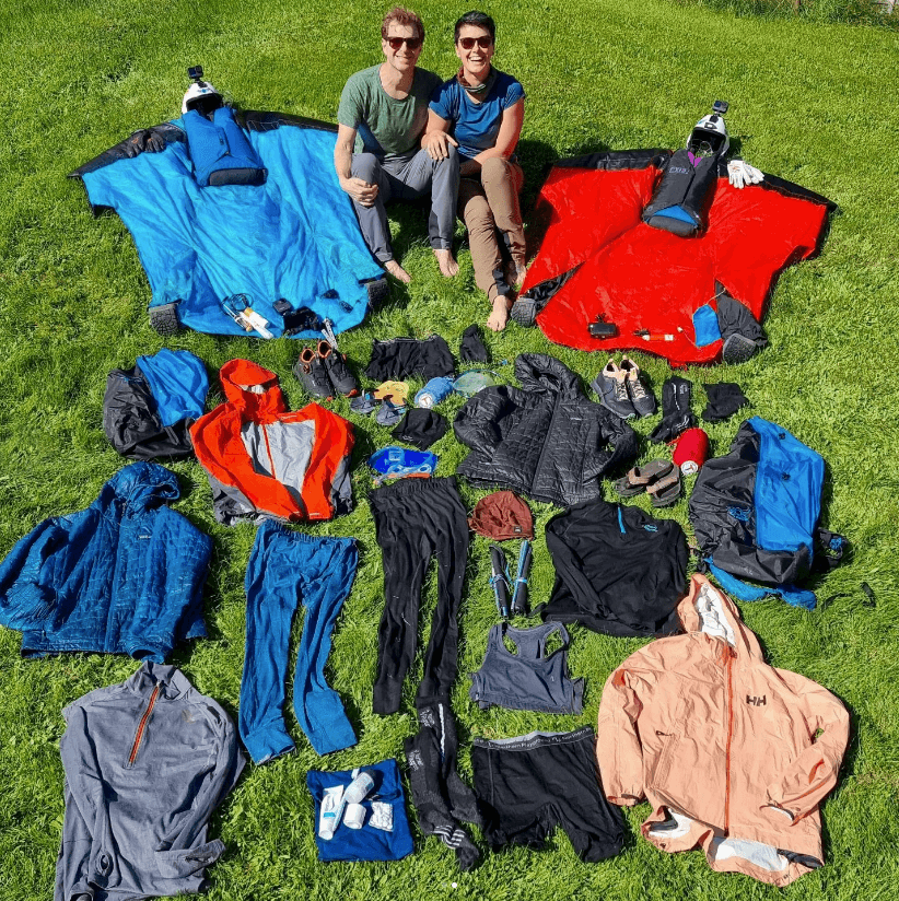 Photo of Amber and Espen laying out everything they packed for a trip.