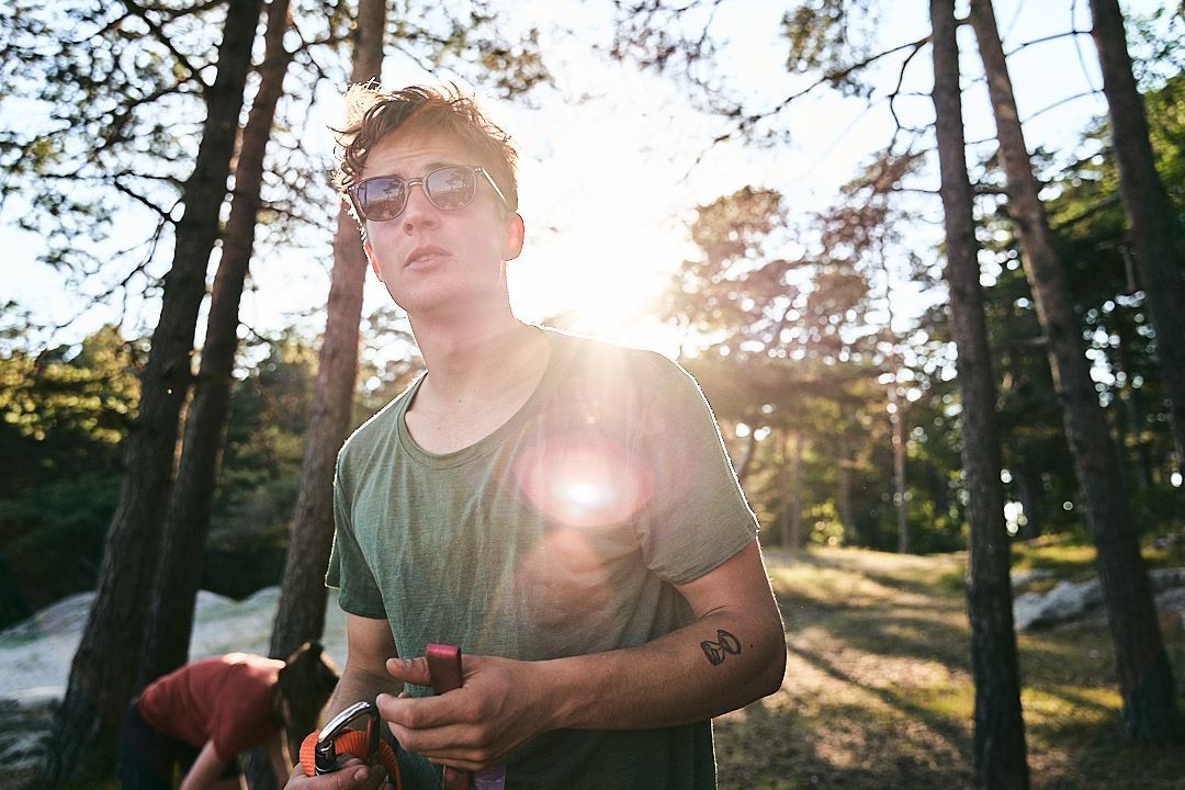 Photo of a man in a green t-shirt.