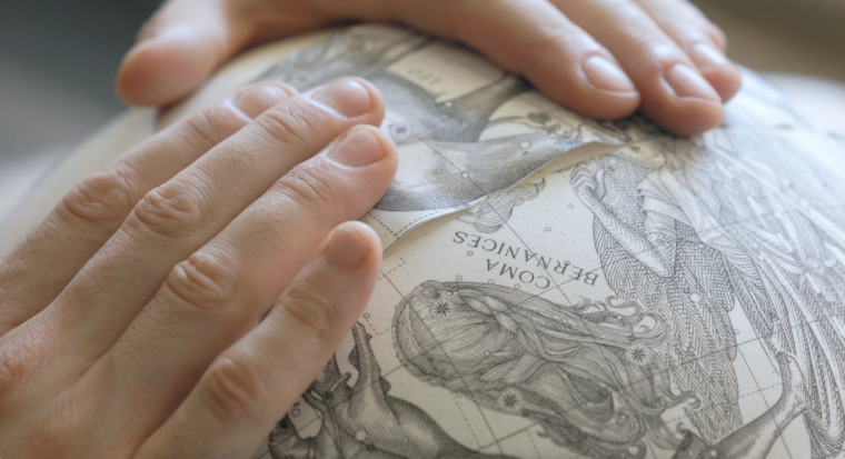 Leonardo Frigo- Globemaker applying map gores on sphere.