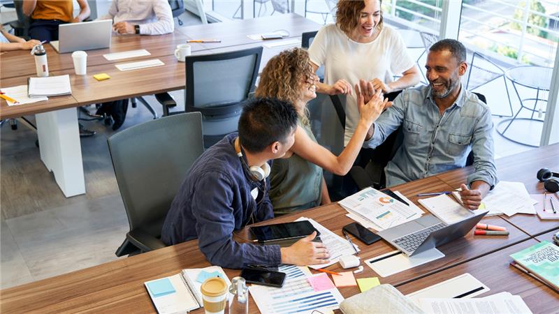 Man using a phone to check digital product info in a store.