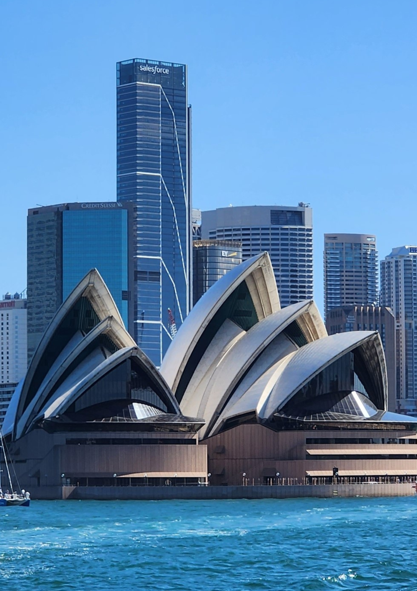 Sydney Opera House with city skyline in the background.
