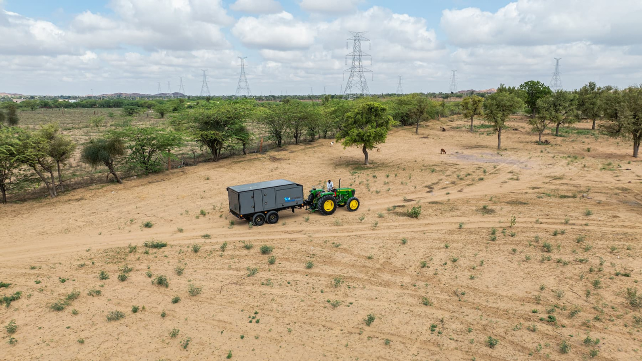 Equipment moving across a remote grid site.