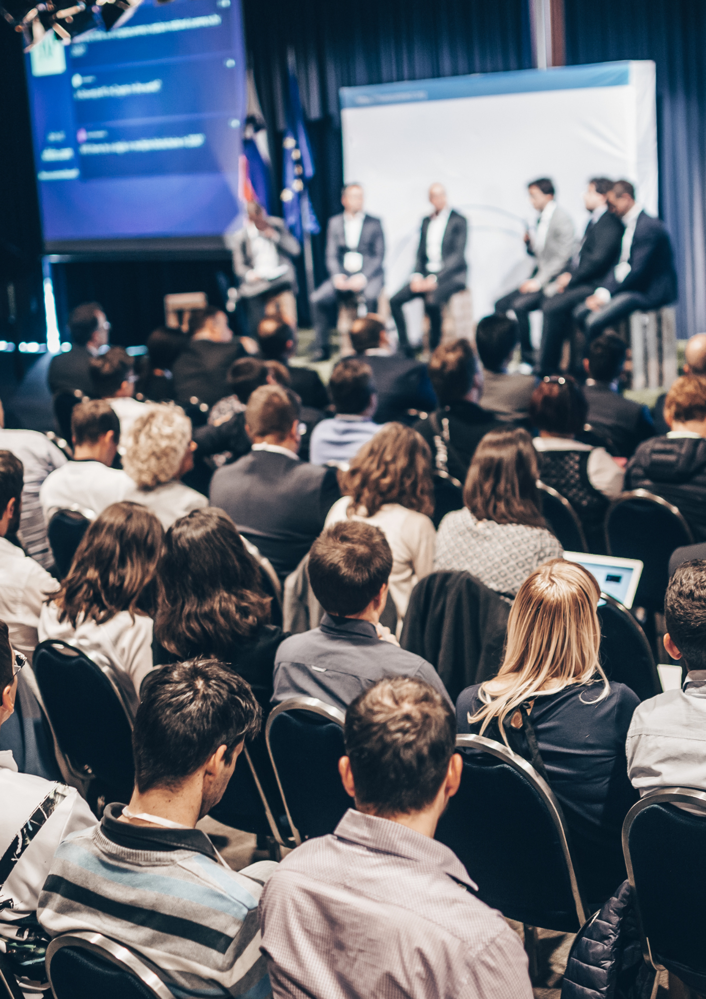 Attendees listening to a panel at a Business NSW event.