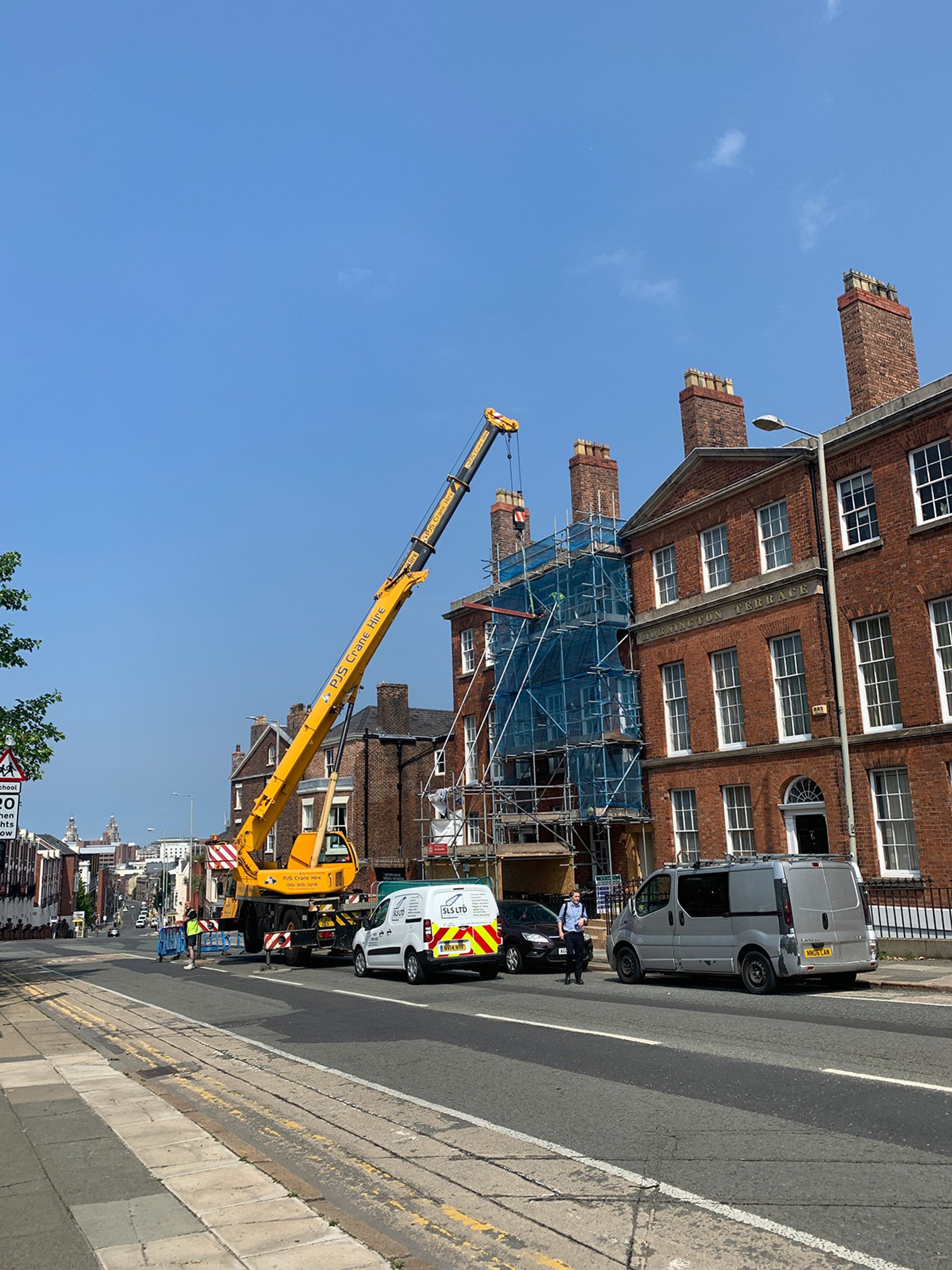 Scaffolding up across the front of the building during works.