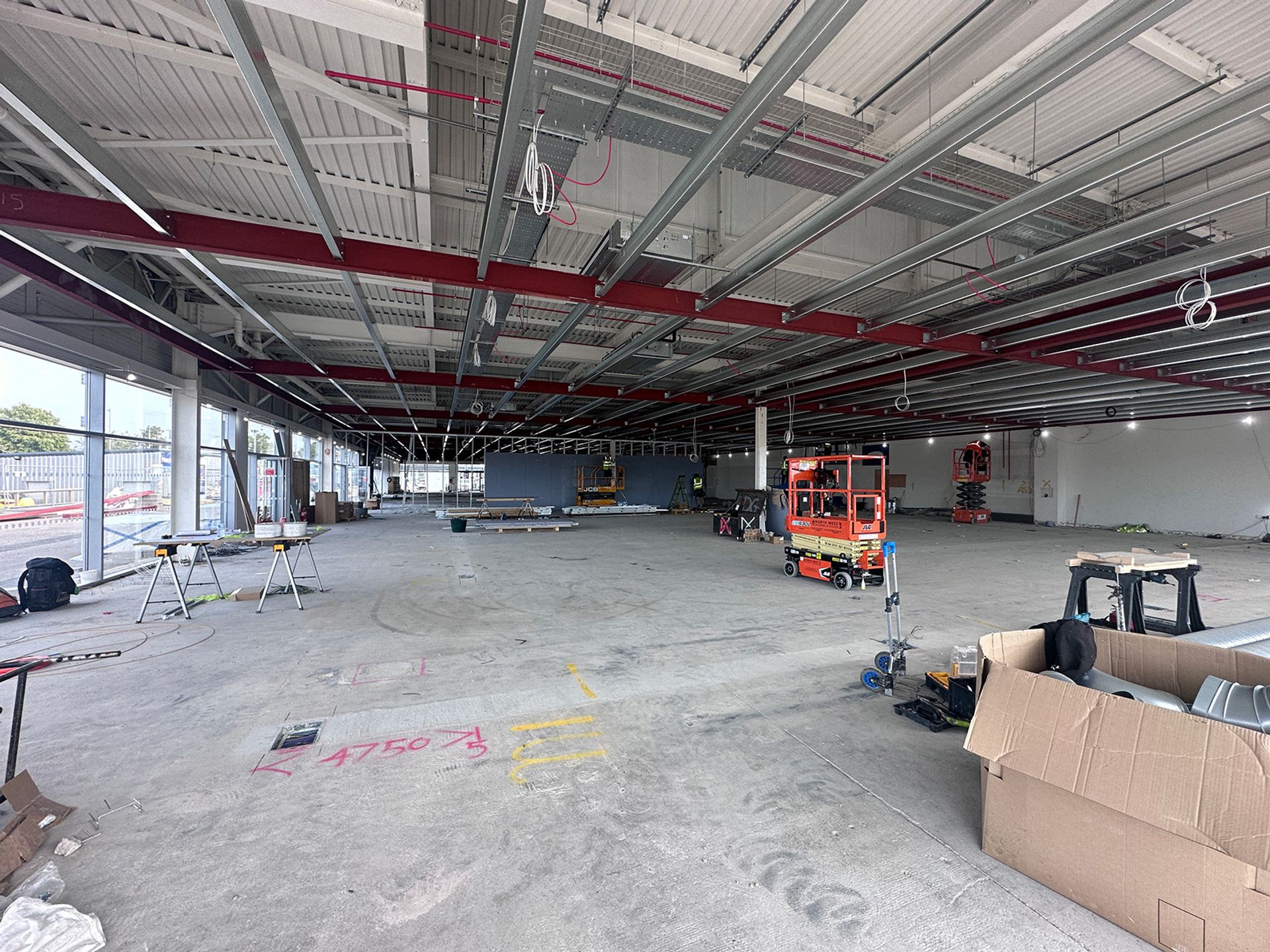Interior works underway inside the showroom shell.