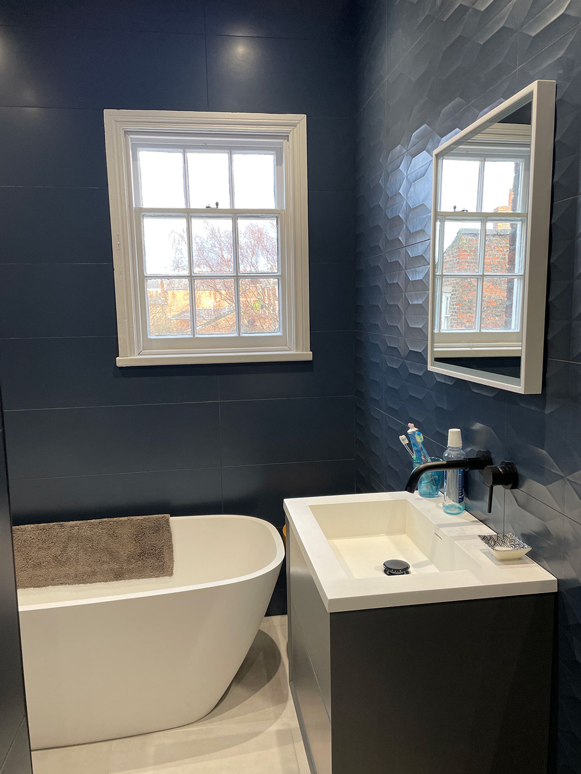 Contemporary bathroom finishes inside the Georgian fabric.