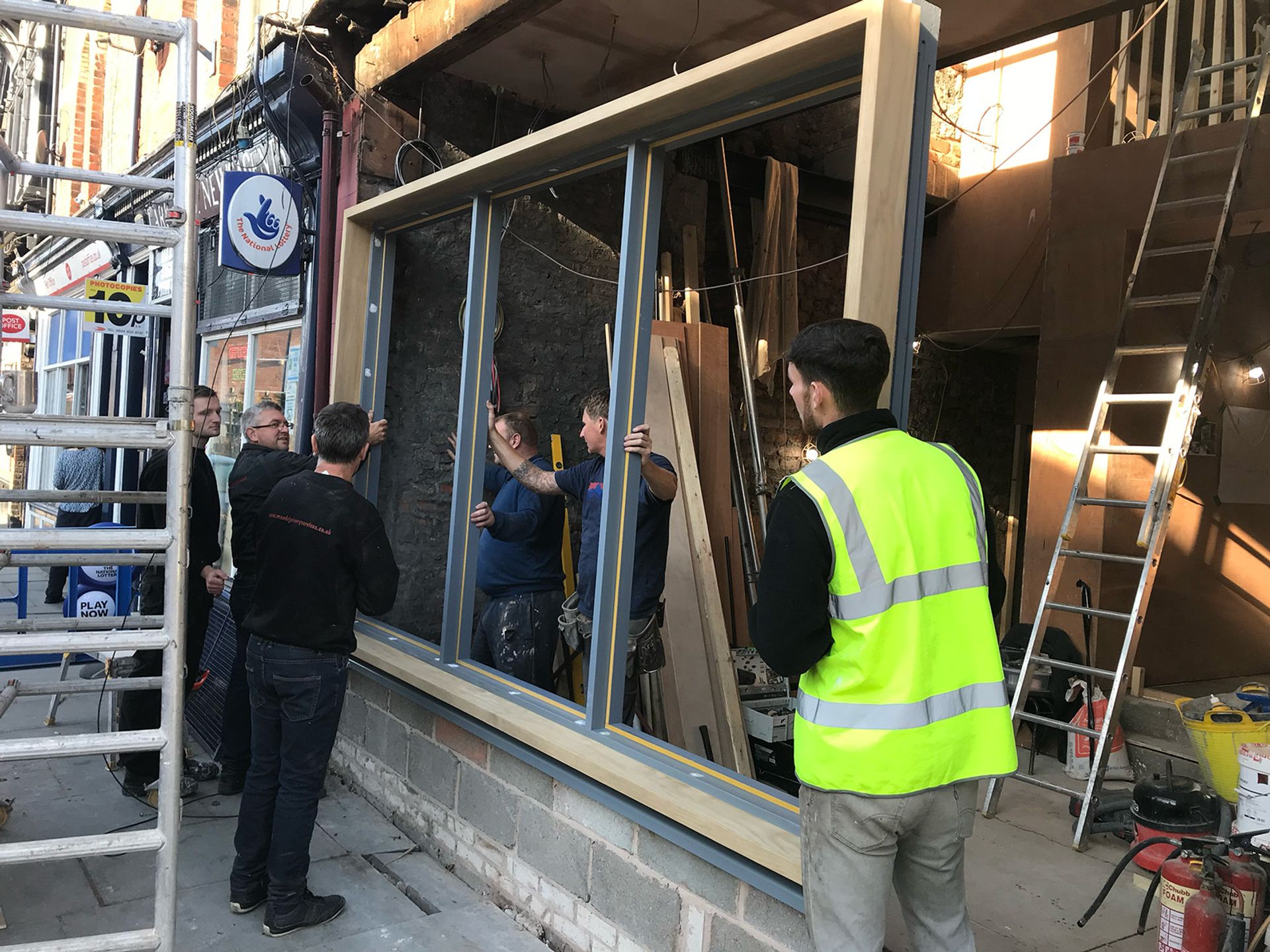 The team fitting new window frames into the front elevation.