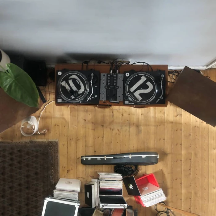 A vinyl mixing setup in a living room from overhead