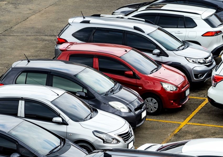 Overhead view of a crowded parking lot with many cars.