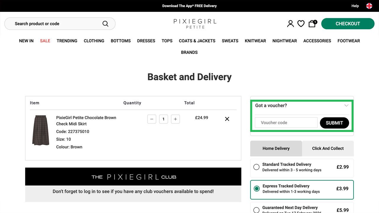 A PixieGirl Petite e-commerce checkout page with a brown check midi skirt in the basket, highlighting the voucher code input field.