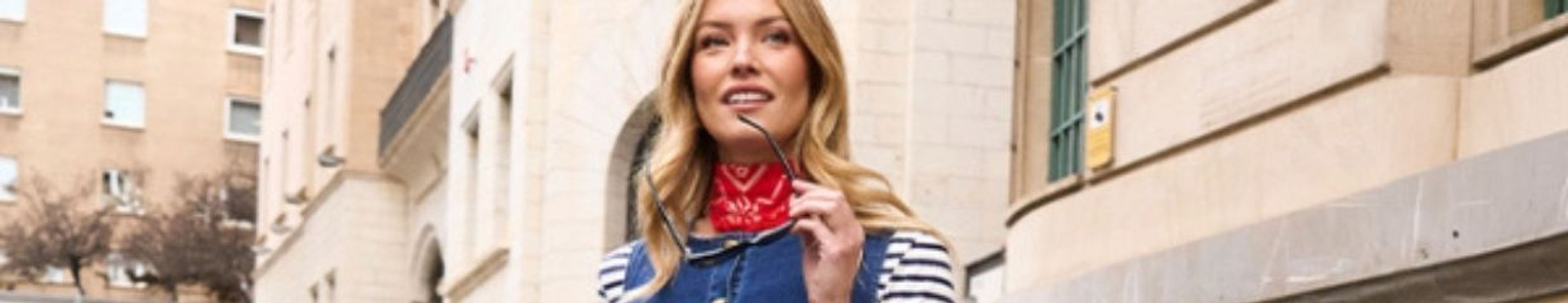 A festive Easter table setting with a bunny, colorful eggs, and candies.