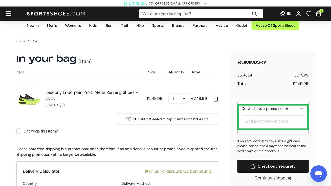 A shopping cart page displaying Saucony running shoes and a highlighted promo code input field.