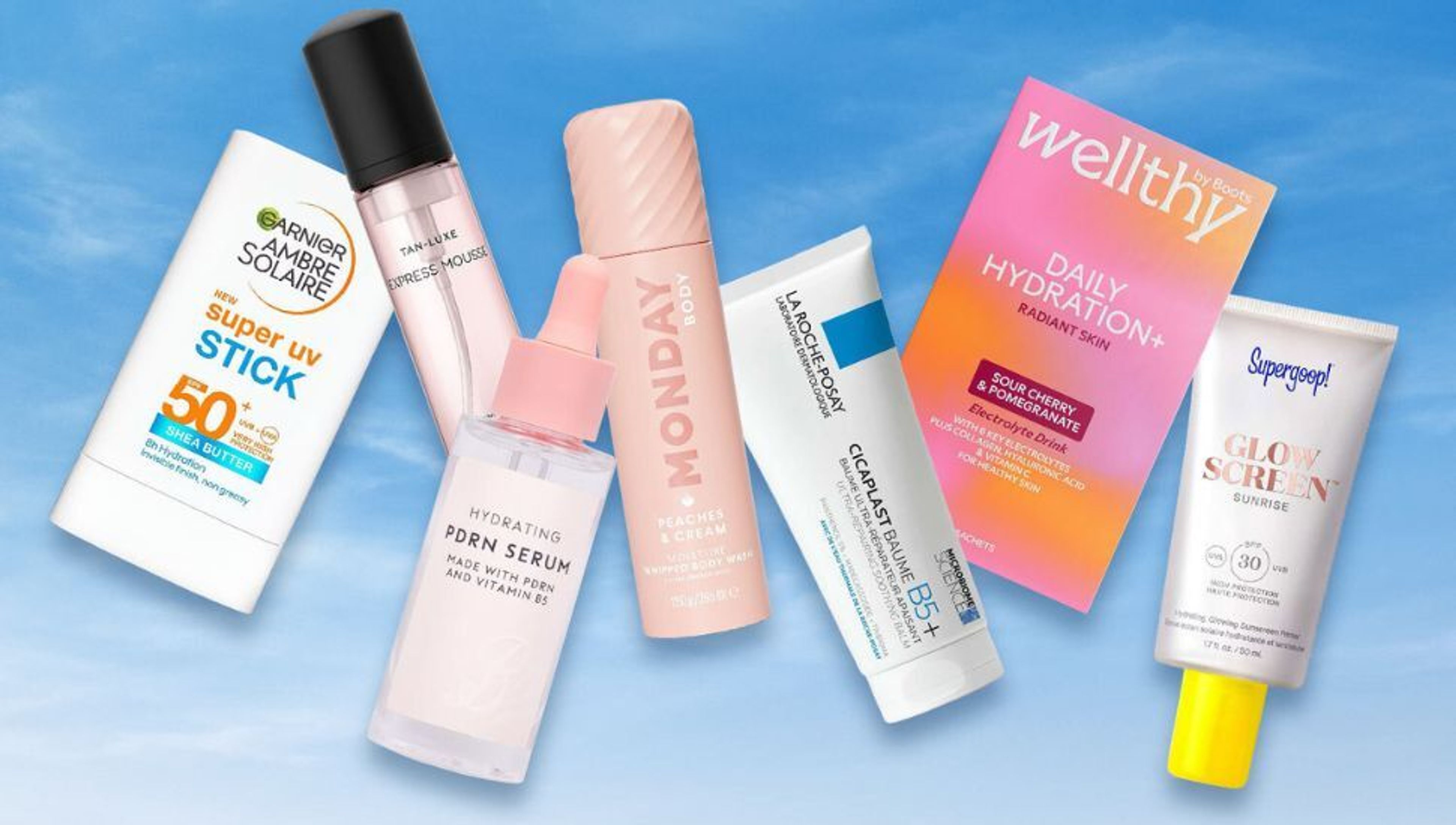 A collection of skincare products including sunscreens, serums, and body sprays, arranged on a blue background.
