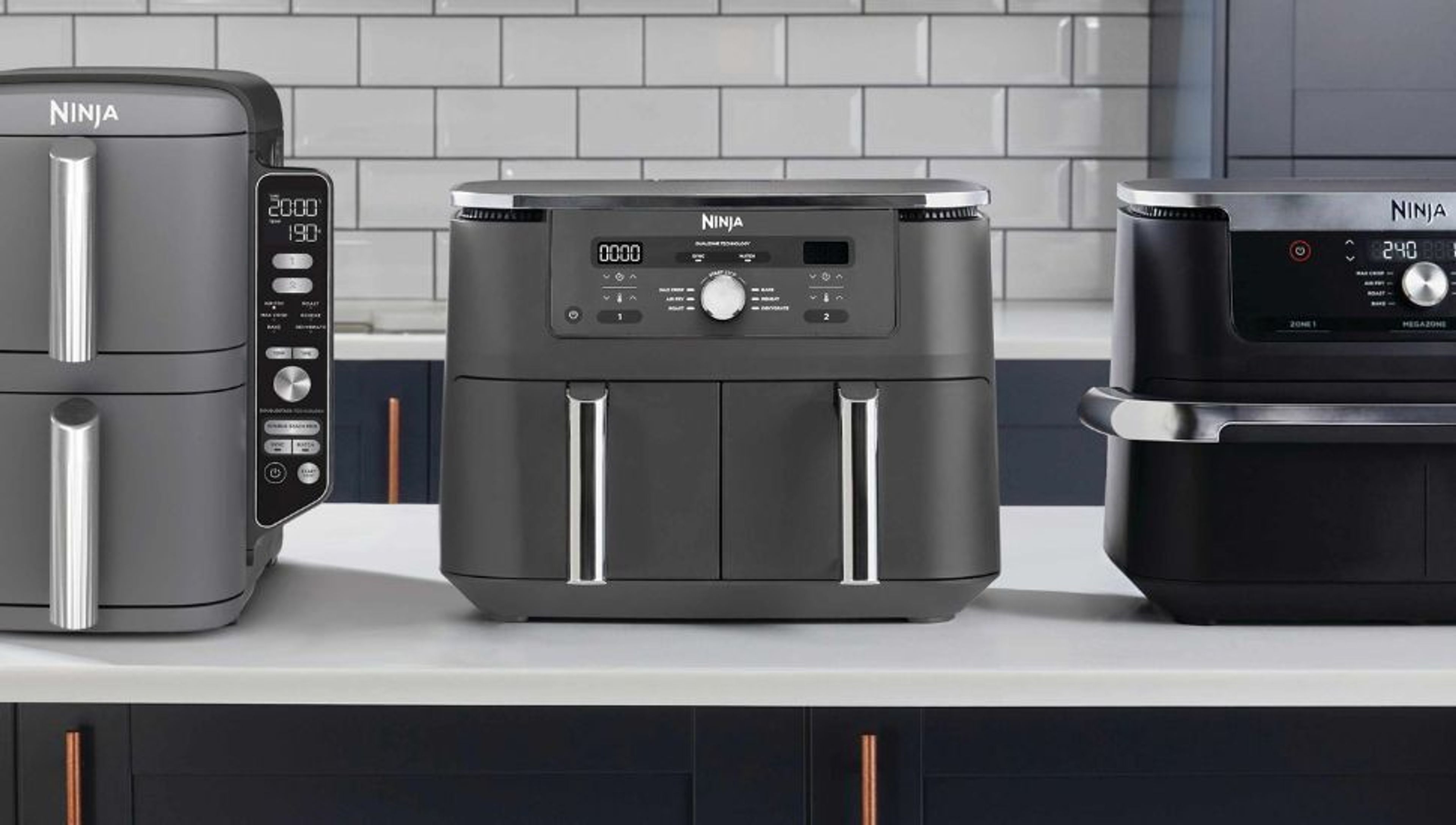 Person vacuuming a light carpet with a dark green Shark vacuum cleaner.