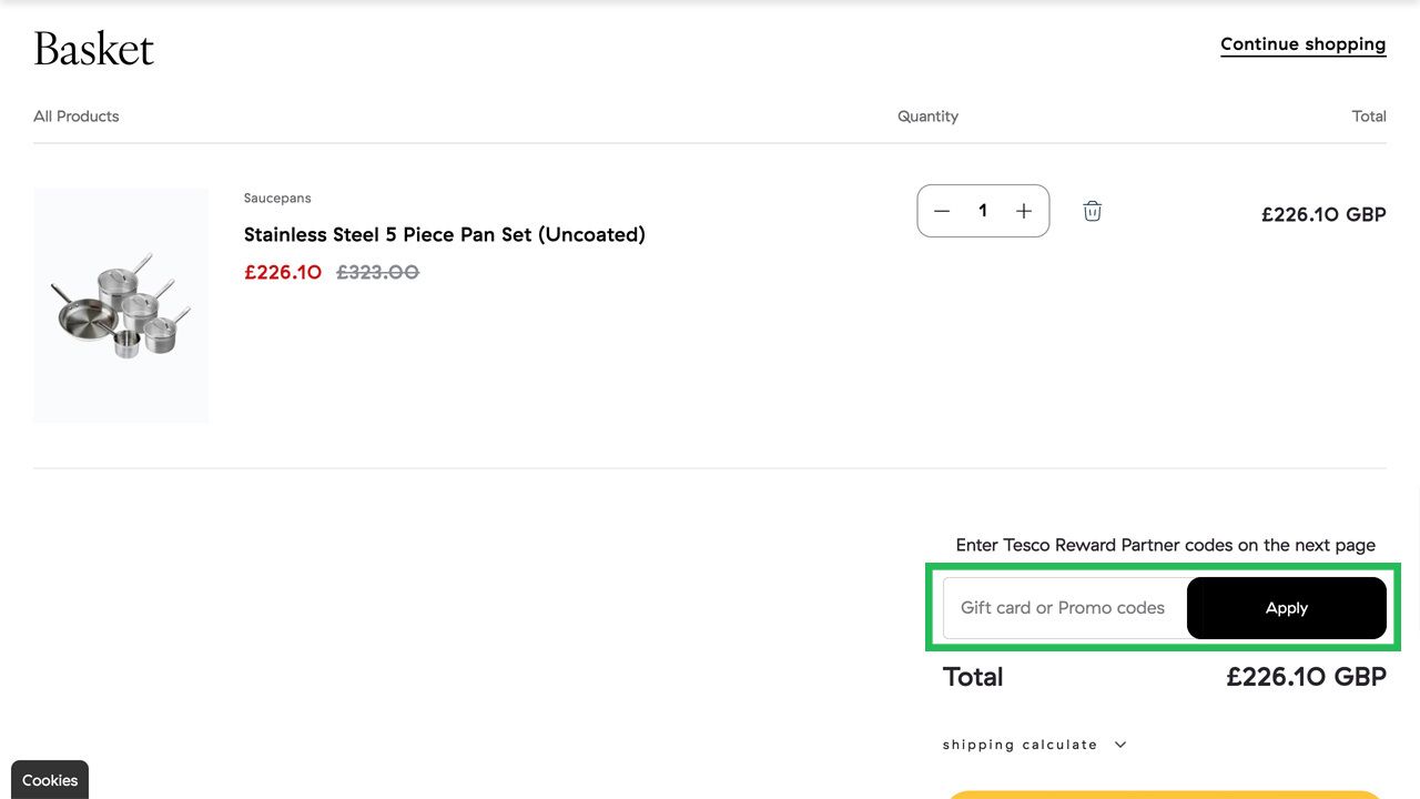 Shopping cart page displaying a 5-piece pan set for £226.10 and a highlighted gift card or promo code input field.