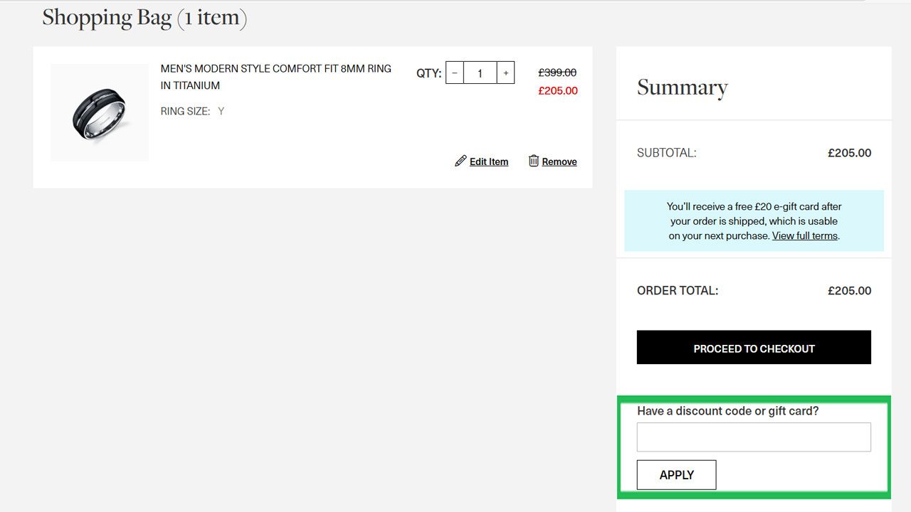 A shopping cart page displaying a titanium ring for £205, with a highlighted field for entering a discount code or gift card.