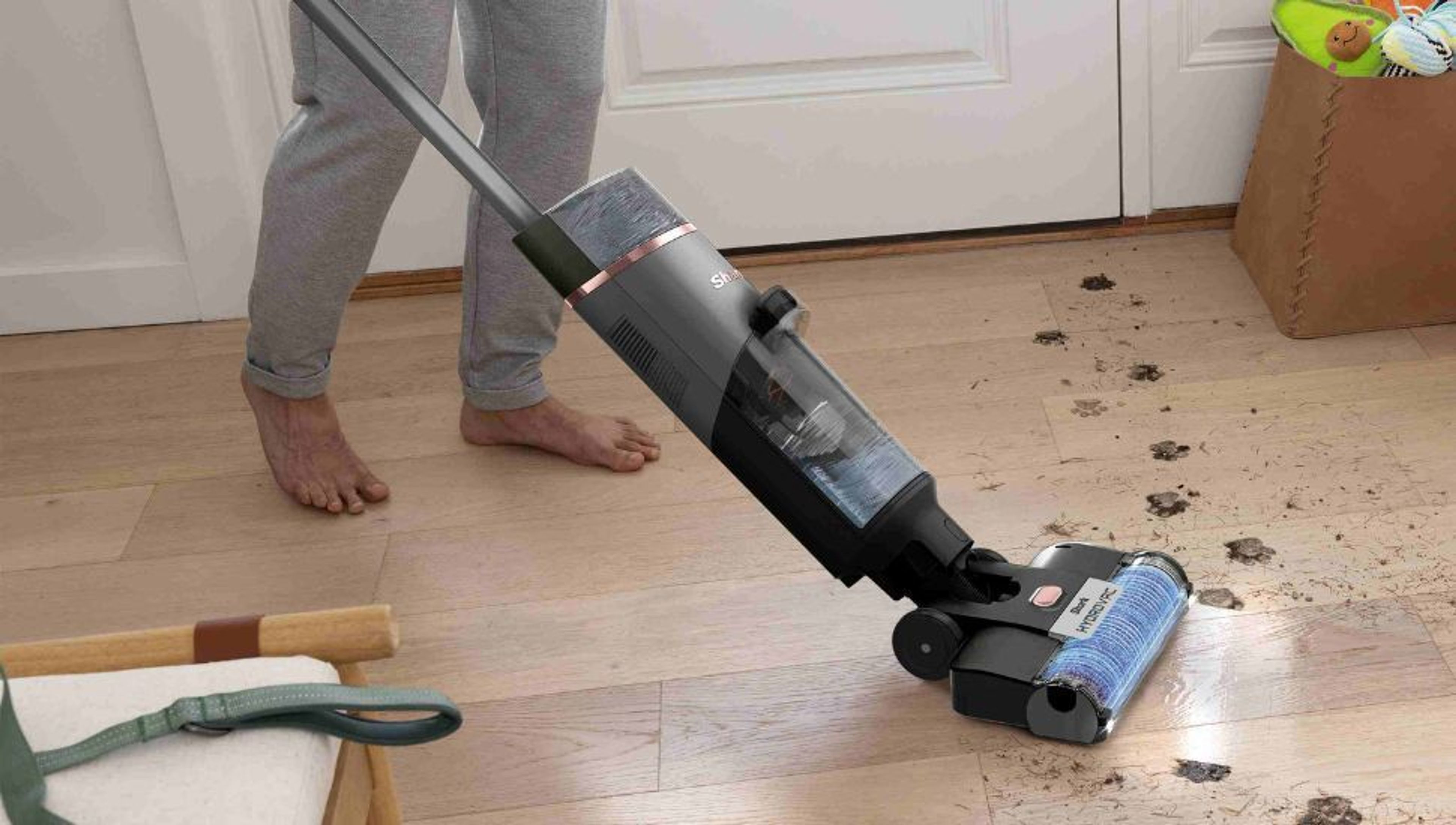 A Shark PowerDetect vacuum cleaner on a patterned rug.