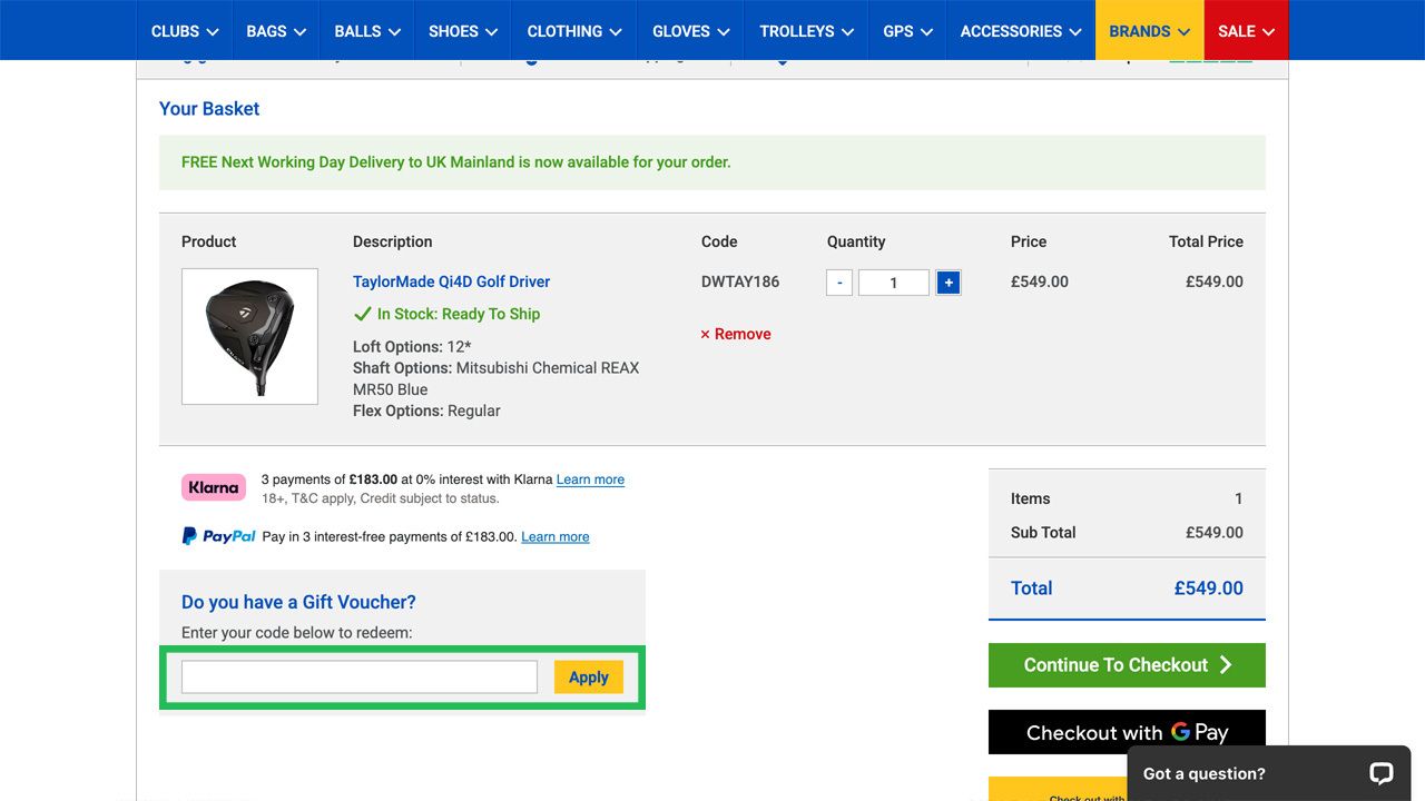 E-commerce shopping cart showing a TaylorMade golf driver for £549.00, with a gift voucher input field and checkout options.