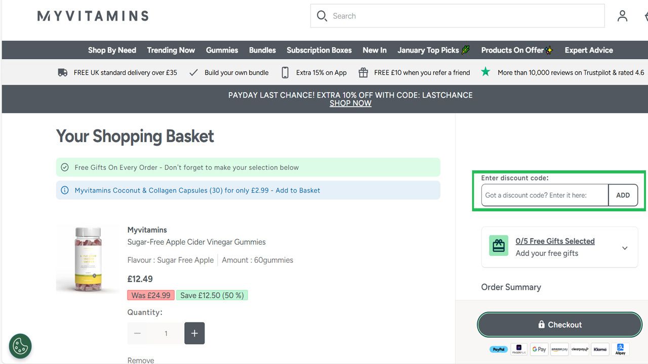 A Myvitamins shopping basket page with sugar-free apple cider vinegar gummies, showing price, quantity, and a highlighted discount code entry field.