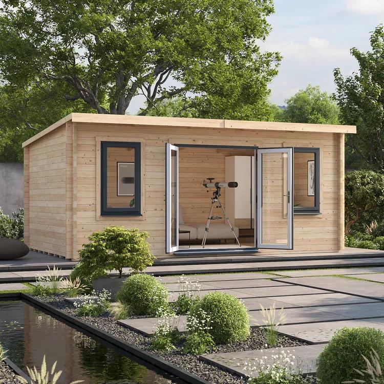 A modern light wood garden office with a flat roof and open bi-fold doors revealing a telescope inside, set on a patio next to a garden pond.