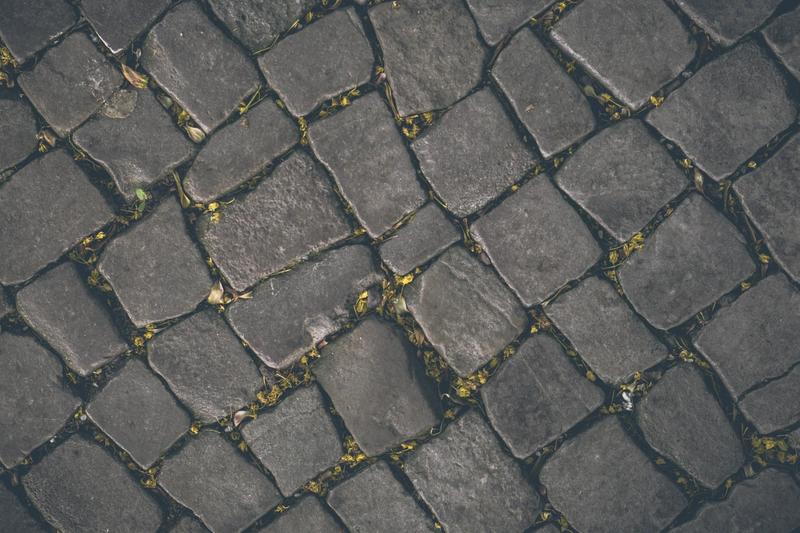 A close up picture of a sidewalk pattern