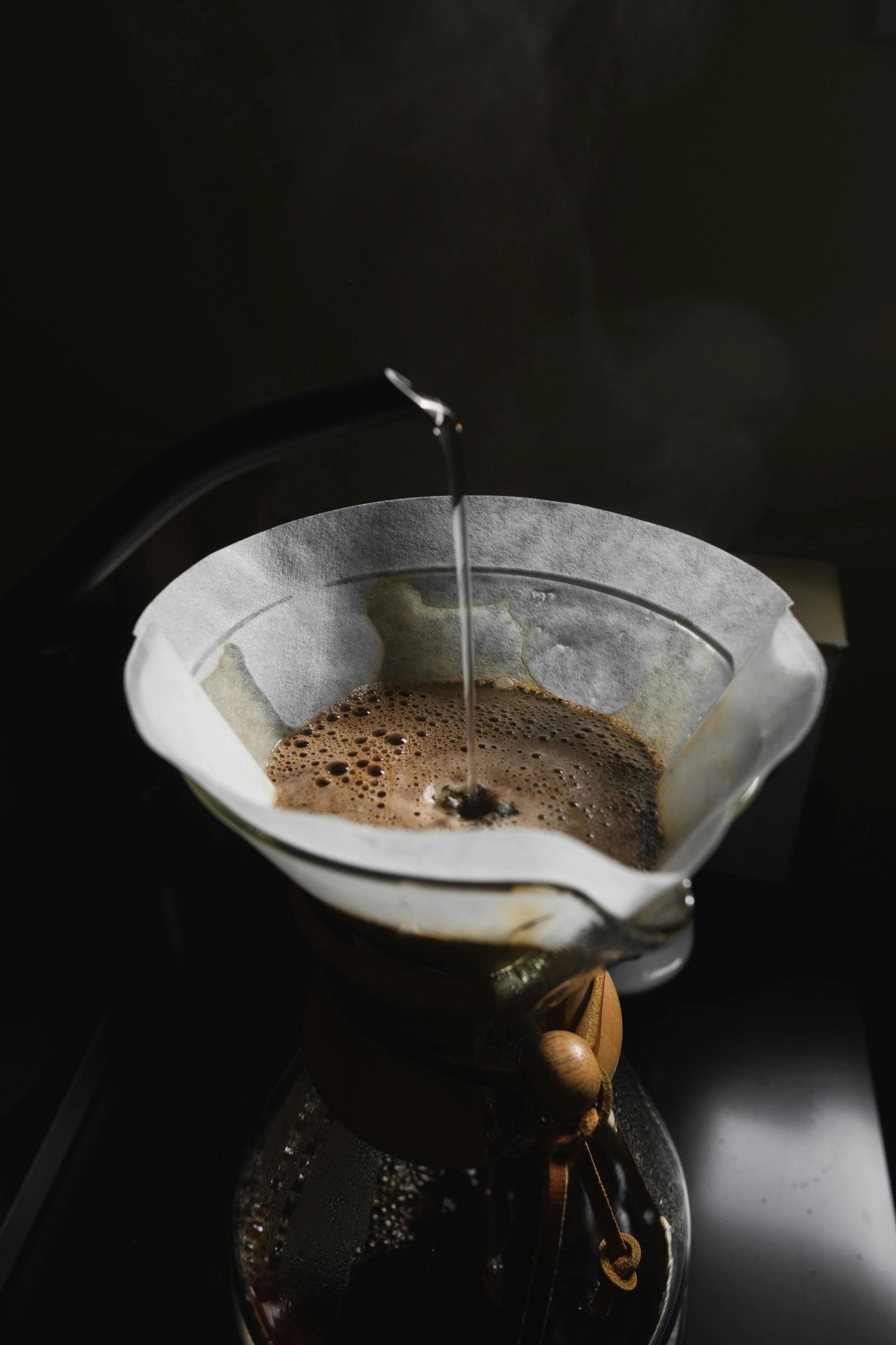 Close-up of coffee dome rising during the bloom phase