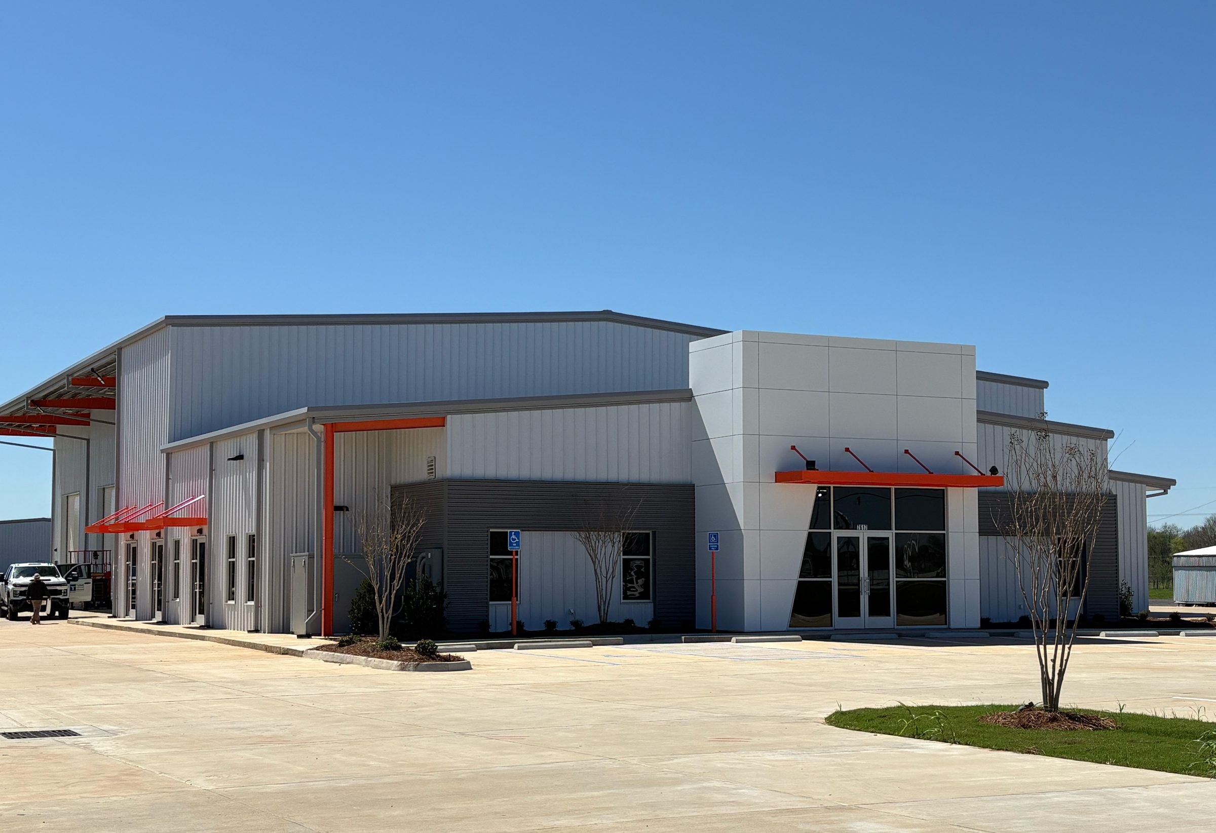 Exterior of the New Scott Equipment facility, a metal and glass industrial building