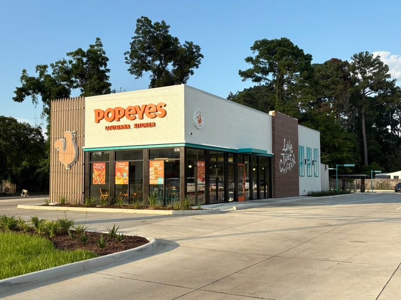 Popeyes restaurant exterior with drive-through lane