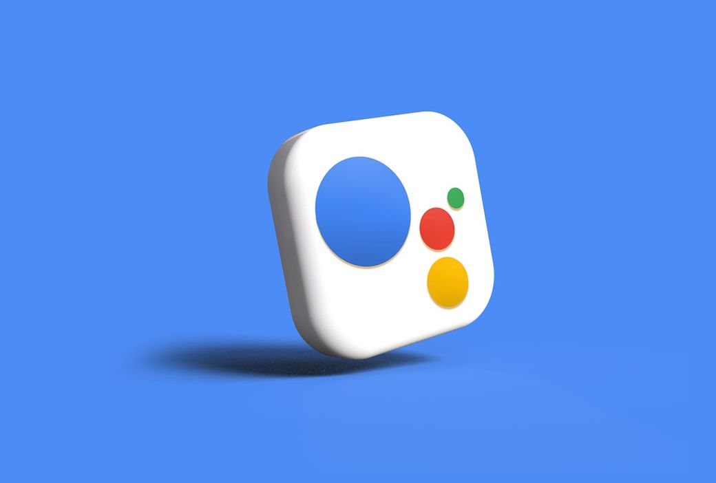 The image features a stylized icon with a circular design against a solid blue background. The icon includes a central circular cutout and three colored dots: red, yellow, and green, suggesting a playful or modern aesthetic. — Credit: Photo by Rubaitul Azad on Unsplash