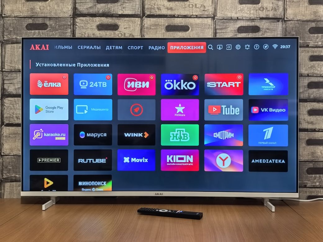 The image shows a smart TV displaying various application icons on its home screen. The interface features a grid layout of colorful app logos, indicating a selection of entertainment and media streaming options. — Credit: Photo by Andrey Matveev on Unsplash