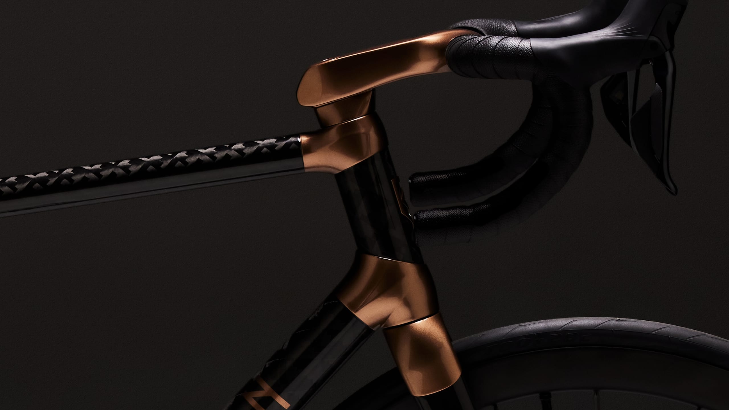 Close up of handles bars of black and gold Bastion Cycles bike frame