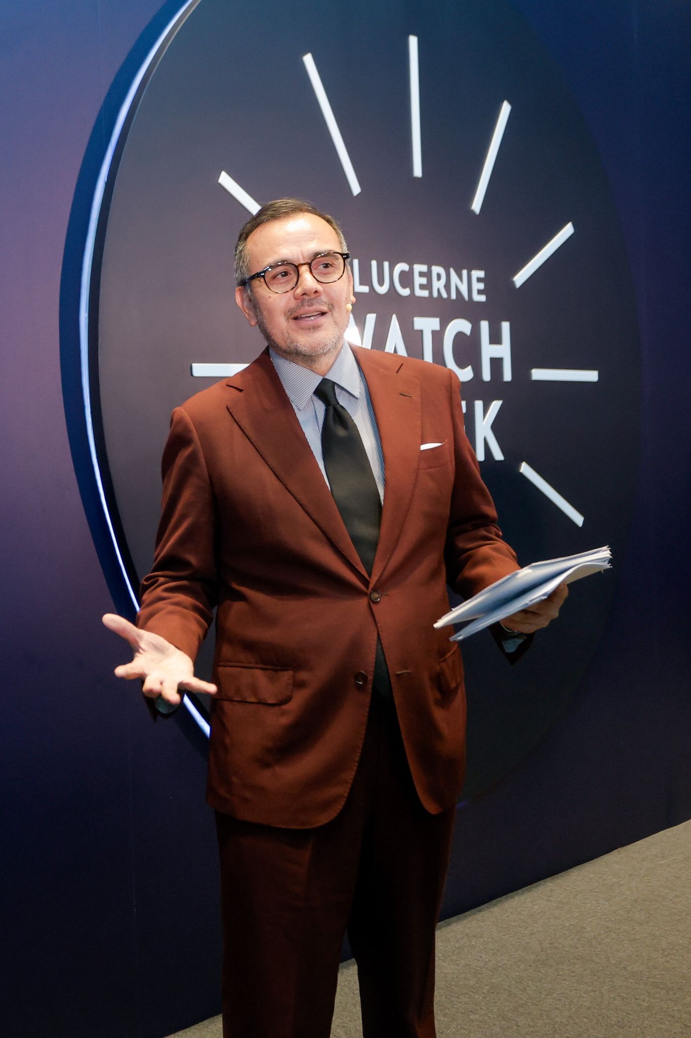 David Celdran in a brown suit hosting Lucerne Watch Week