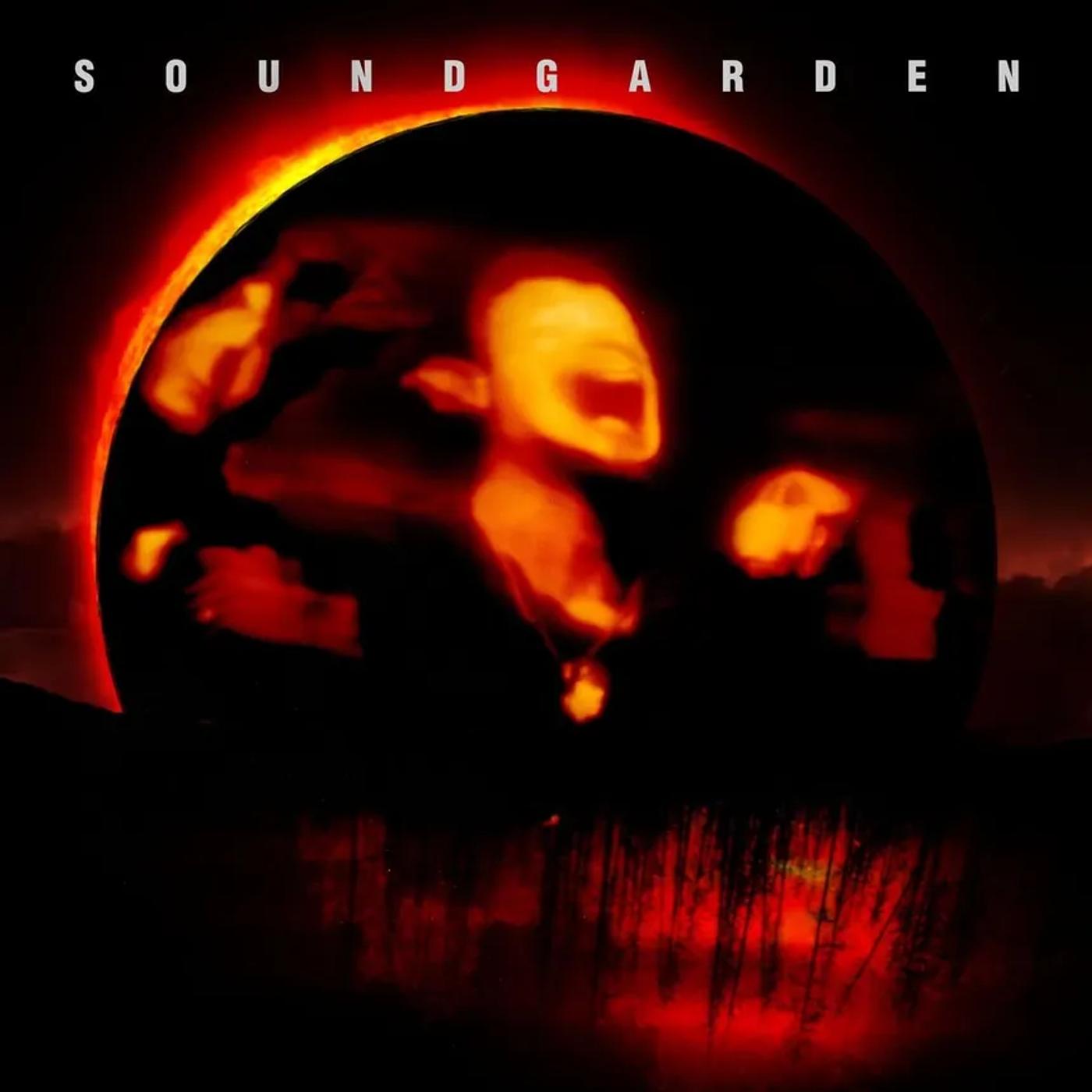 Soundgarden’s Superunknown cover, a screaming face distorted inside a fiery eclipse ring