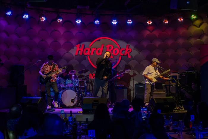 The Dawn perform on the Hard Rock Cafe Manila stage under colored lights at the anniversary party