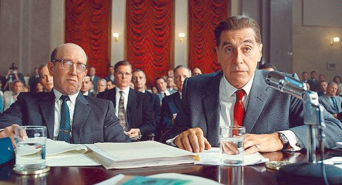 Al Pacino as Jimmy Hoffa testifying at a Senate hearing table stacked with papers and water glasses