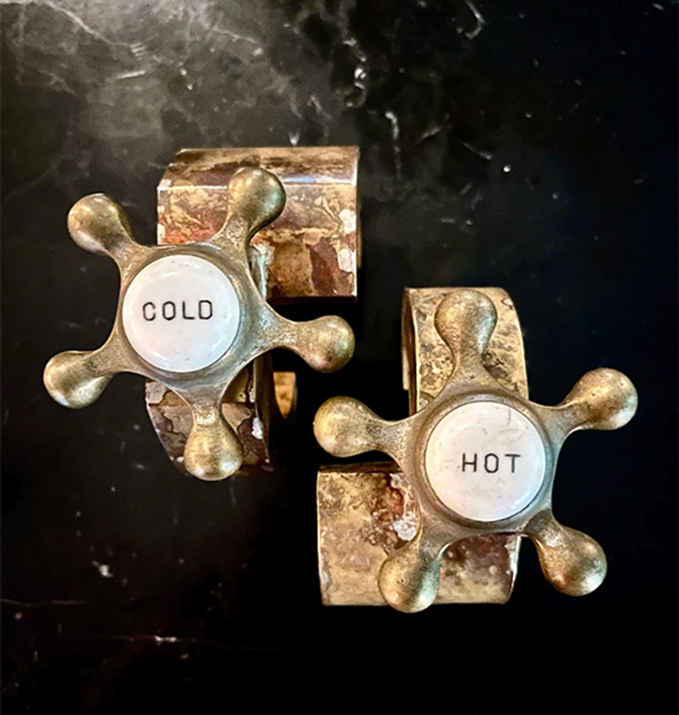 Modular brass cuffs by Michelline Syjuco fitted with antique Cold and Hot bathroom tap handles