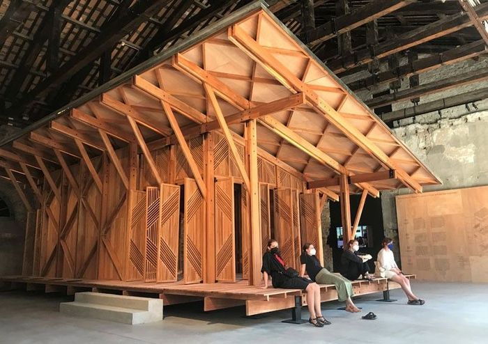 Interior of the Philippine Pavilion at the Venice Architecture Biennale featuring the wooden library structure and daily visitors