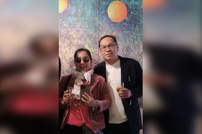 Fe and Darwin Gutierrez posing together in front of the brick archway at the biennale