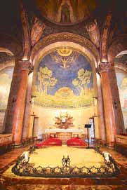 Blue mosaic apse and violet-lit altar inside the Church of All Nations at Gethsemane