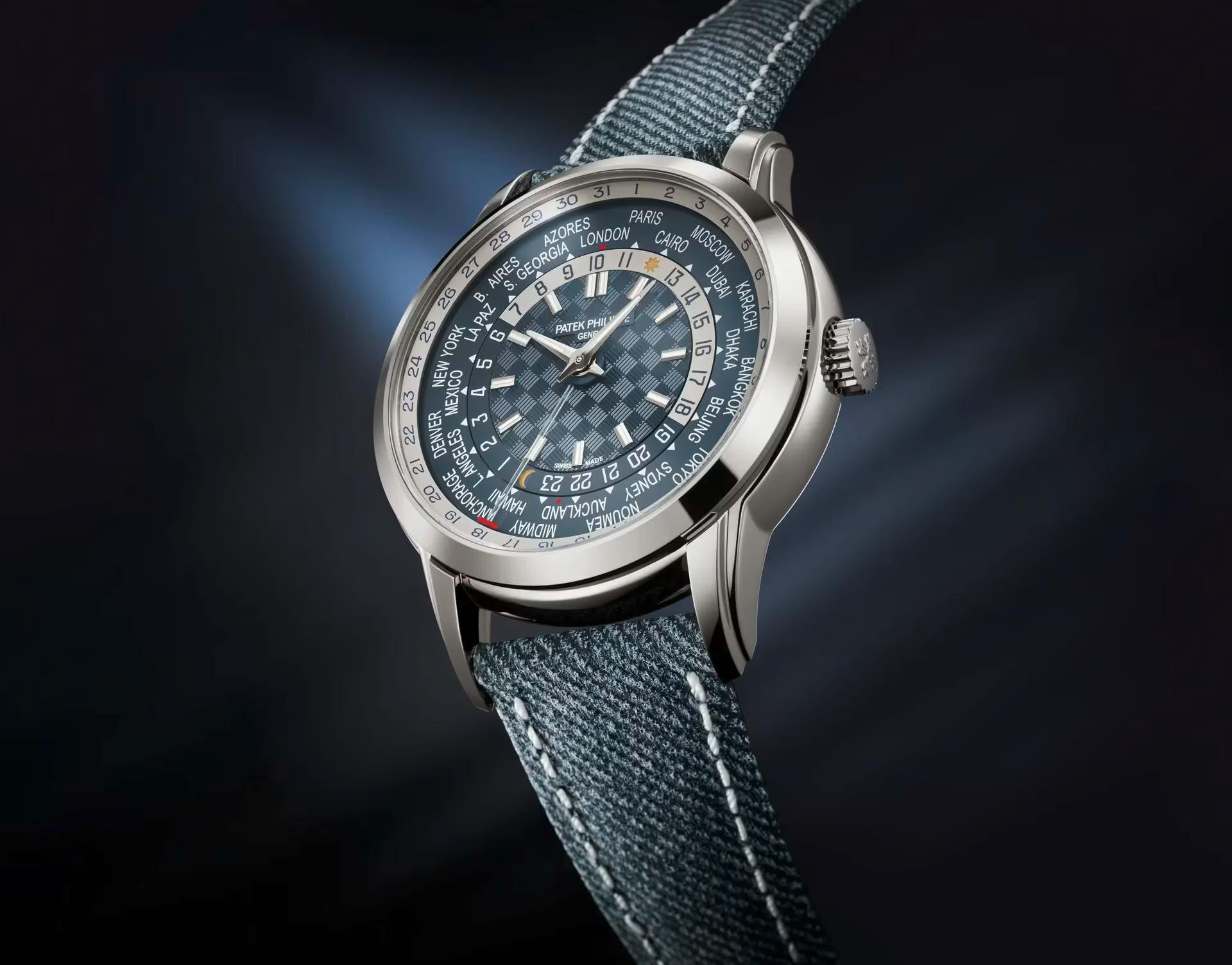 The blue dial Patek Philippe Ref. 5330G-001 World Time watch with denim-patterned calfskin strap, displaying time zones and dates